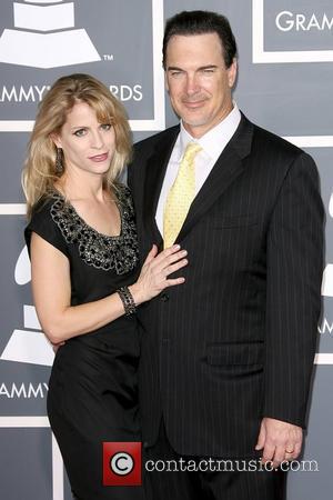 Guest and Patrick Warburton The 53rd Annual GRAMMY Awards at the Staples Center - Red Carpet Arrivals Los Angeles, California...