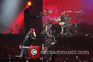 Axl Rose and Guitarist/ songwriter Dj Ashba of Guns N' Roses performs at the American Airlines Arena during his North...