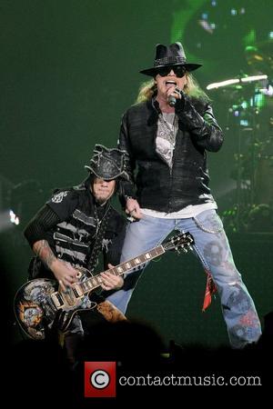 Axl Rose and DJ Ashba  Guns N' Roses perform on stage at Copps Coliseum in Hamilton, Ontario. Hamilton, Canada...