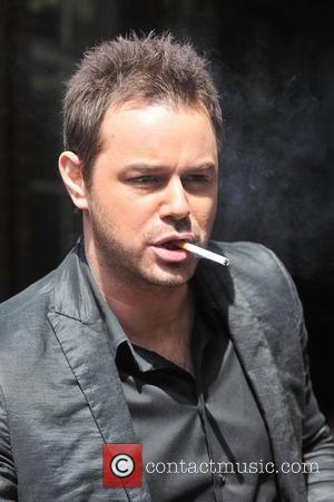 Danny Dyer smoking a cigarette  Celebrities outside the ITV television studios London, England - 19.05.11
