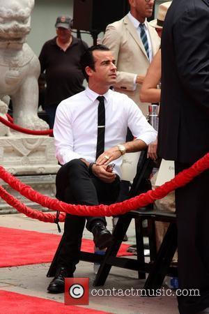 Justin Theroux Jennifer Aniston is honoured with a Hand and Footprint Ceremony outside Grauman's Chinese Theatre, while her boyfriend looks...