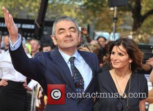 Rowan Atkinson and Sunetra Sastry Johnny English Reborn - UK film premiere held at the Empire Leicester Square - Arrivals...