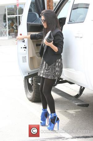 Kourtney Kardashian getting out of her truck in Beverly Hills Los Angeles, California - 07.04.11