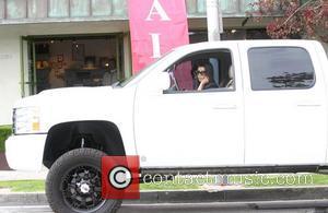 Kourtney Kardashian driving her truck in Beverly Hills Los Angeles, California - 07.04.11