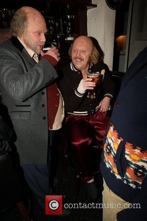 Keith Lemon and Rufus Hound disguised as two old bald men, enjoying a pint of beer at a pub, in...