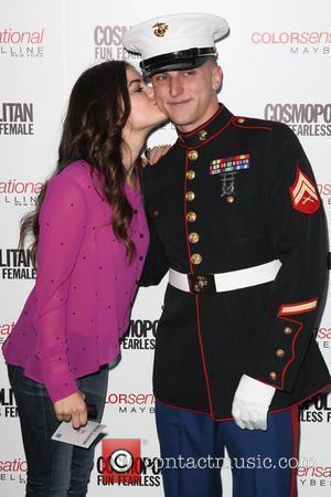 Lucy Hale kisses a U.S. Marine 3rd annual 'Kisses for the Troops' event on Veterans Day, held at Military Island,...