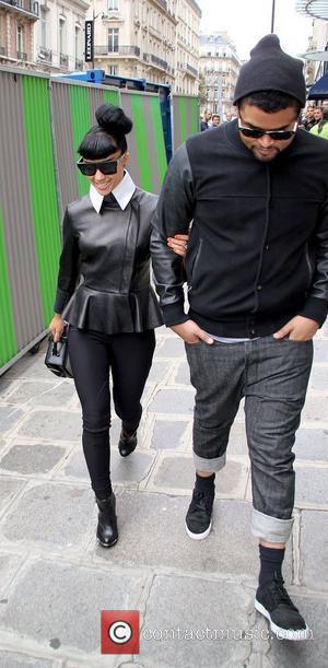 Natalia Kills English singer-songwriter walking in Paris wearing large black sunglasses Paris, France - 21.09.11