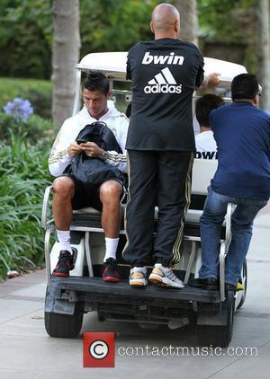 Real Madrid forward Cristiano Ronaldo leaves a training session with the rest of his team mates ahead of their match...