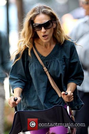 Sarah Jessica Parker  pushing one of her twin daughters in stroller in Soho New York City, USA - 02.08.11