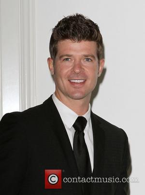 Robin Thicke at the 2011 Silver Rose gala and auction at Beverly Hills Hotel. Beverly Hills, California - 17.04.11