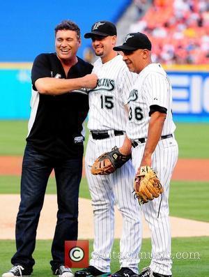 Steven Bauer (L) throw the first pitch during the Florida Marlins Vs. The Washington National Baseball game at Sun Life...