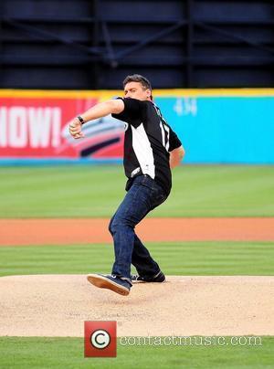 Steven Bauer throw the first pitch during the Florida Marlins Vs. The Washington National Baseball game at Sun Life Stadium....