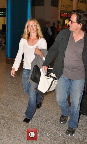 Elisabeth Shue and her director husband Davis Guggenheim arrive at at Toronto Pearson International Airport for the Toronto International Film...