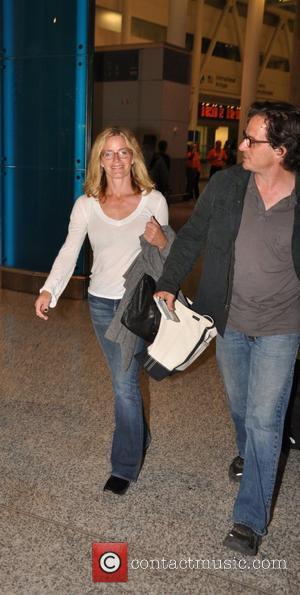 Elisabeth Shue and her director husband Davis Guggenheim arrive at at Toronto Pearson International Airport for the Toronto International Film...