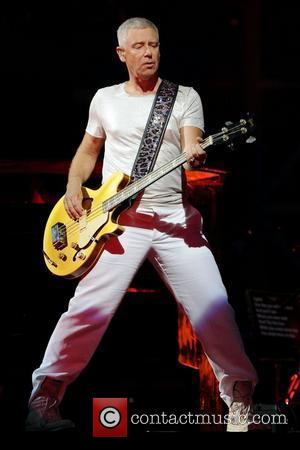 Adam Clayton  performs on stage during the 'U2 360 Tour' at the Rogers Centre.  Toronto, Canada - 11.7.11