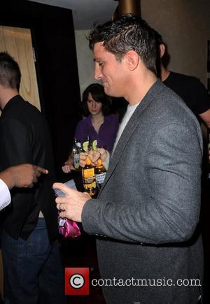 Alex Reid enjoys drinks from the free bar  UK premiere of 'Zebra Crossing' at the Empire Leicester Square London,...