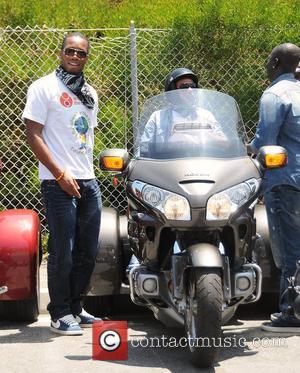 Didier Drogba and Ashley Cole Professional football players from the English Premier League host an event at Eaglerider Motorcycles in...