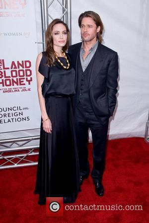 Angelina Jolie and Brad Pitt  Premiere of 'In the Land of Blood and Honey' at the School of Visual...