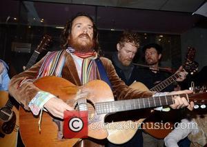 Damien Rice, Glen Hansard Bono and Glen Hansard join buskers singing for charity at the entrance to St Stephen's Park...