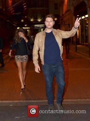 Brian McFadden and Vogue Williams hail down a taxi as they leave Dublin's Wilde bar after watching a Burlesque show....