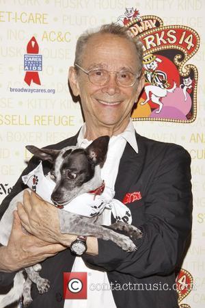 Joel Grey holds Drago, a dog up for adoption Broadway Barks: The 14th Annual Dog and Cat Adopt-a-thon held in...