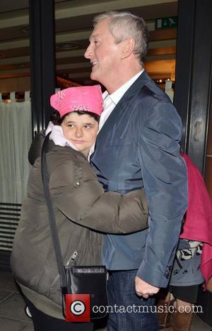 Louis Walsh and celebrity hugger Tanya Macintosh  X Factor judges outside C London restaurant, after earlier appearing on the...