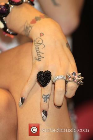 Cher Lloyd shows her tattoos and jewelry British singer Cher Lloyd meet her 'Brats' and performs her new song 'Want...