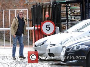 Michael Le Vell, who plays Kevin Webster in 'Coronation Street', checks for damage under his Ford Puma car. The actor...