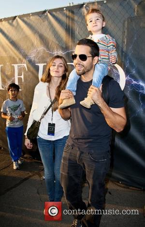 Alizee Guinochet, David Blaine and their daughter Dessa  walk around the site of his latest challenge, 'Electrified' which features...