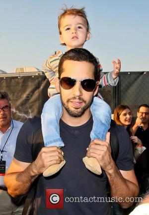 David Blaine and daughter Dessa   walk around the site of his latest challenge, 'Electrified' which features Blaine attached...