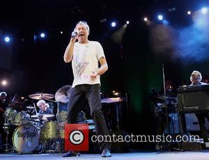 Deep Purple's Ian Gillan performing on stage at the O2 Arena as part of Deep Purple with a 32 piece...