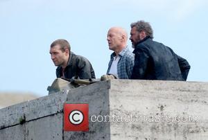 Jai Courtney, Bruce Willis and Sebastian Koch shooting a scene on the film set of 'A Good Day to Die...