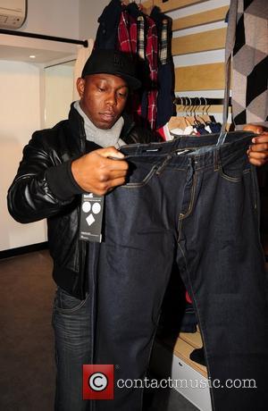 Dizzee Rascal shopping at the opening of 'Boxpark', a pop-up shopping complex created from shipping containers in London's trendy Shoreditch...