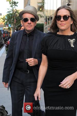 Elvis Costello and wife Diana Krall heads to a their car outside the Trump Soho Hotel New York City, USA...