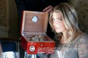 Fergie posted this picture of herself on Twitter with the quote, 'Mmmm. Nothing like the scent of #truffles.' USA -...