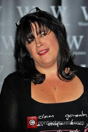 E. L. James signs copies of her...