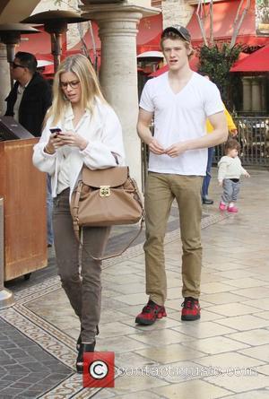 Lucas Till and his girlfriend walk through The Grove West Hollywood, California - 19.01.12
