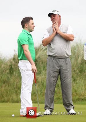 Shane Filan of Westlife and Darren Clarke Pro-am for the 2012 Irish Open held on the Dunluce Links at at...