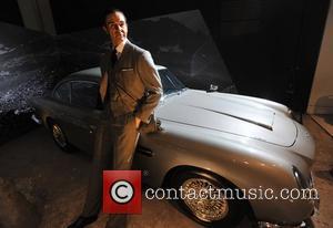 1964 Aston Martin DB5 with a Sean Connery wax figure Designing 007 - Fifty Years of Bond Style - press...