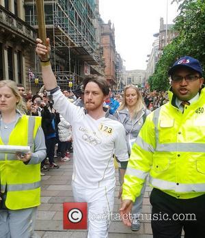 James McAvoy carries the Olympic flame down Buchanan Street in Glasgow Glasgow, Scotland - 08.06.12