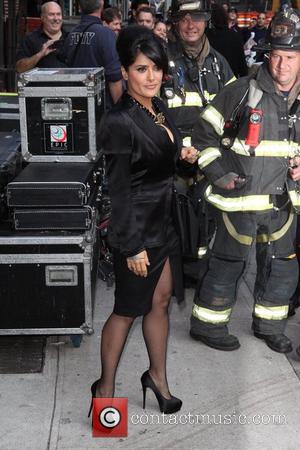 Salma Hayek posing with firefighters 'The Late Show with David Letterman' held at the Ed Sullivan Theatre - Arrivals New...