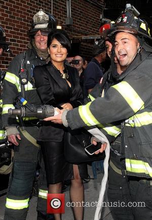 Salma Hayek posing with firemen 'The Late Show with David Letterman' held at the Ed Sullivan Theatre - Arrivals New...