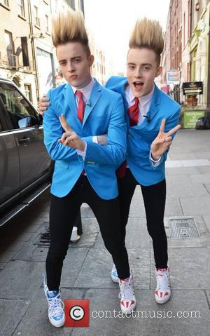 Jedward twins John and Edward Grimes pose outside Muzu TV studios on South Williams Street and get into a game...