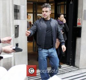 Robbie Williams leaving the BBC Radio 2 studios London, England - 22.10.12