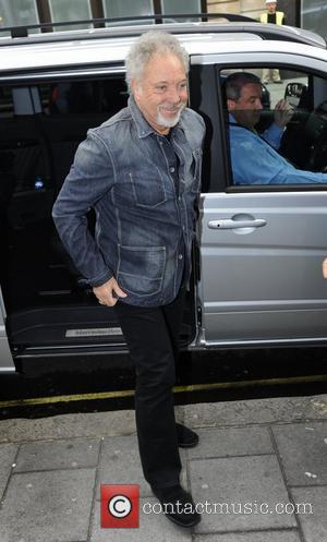 Tom Jones arrives at the BBC Radio 1 studios, to promote the television show 'The Voice', on which he is...