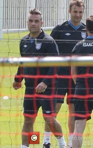 Robbie Williams and Jason Isaacs  Training for the Soccer Aid match which will be held in Manchester's Old Trafford...
