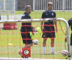 Robbie Williams and Teddy Sheringham Training for the Soccer Aid match which will be held in Manchester's Old Trafford stadium...