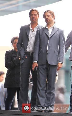 Brad Pitt and his stunt double filming a scene of his new movie 'The Counselor' on location in London The...