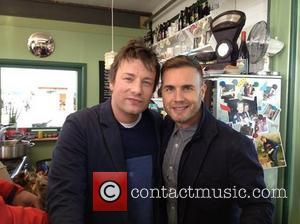 Gary Barlow posted this image of himself with Jamie Oliver on Twitter with the caption: Been in Jamie's kitchen this...