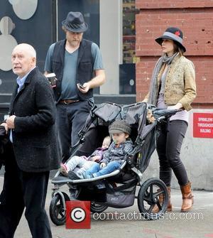 Renn Hawkey, Vera Farmiga, Gytta Lubov Hawkey and Fynn Hawkey Vera Farmiga pushing her children in a stroller while out...